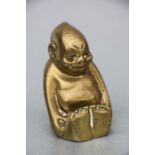 A brass Billiken car accessory mascot, 8.5cms high.