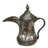 A Turkish / Islamic tinned copper dallah, 20cms high.