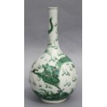 A Chinese famille verte bottle vase decorated with a dragon amongst clouds chasing a flaming