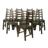 A set of eight Arts & Crafts style oak ladder back chairs (8).