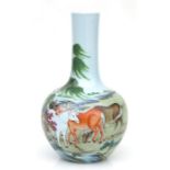 A Chinese famille rose bottle vase decorated with horses in a landscape, blue seal mark to the
