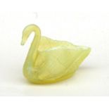 A Uranium pressed glass vase in the form of a swan, registration no: 20086, 11.5cms wide.