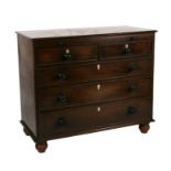 A 19th century mahogany chest of two short and three graduated long drawers with brushing slide