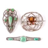 A sterling silver Arts & Crafts clip set with jade cabochons; together with two similar white