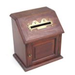 A Victorian oak country house table top letters box, the sloped top with brass letters slot having