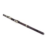 A Rudall Carte & Co. Ltd rosewood flute, No. 5409, 67cms long.