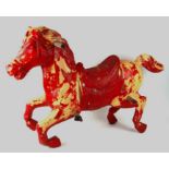 A 20th century painted plastic carousel horse, 108cms long.