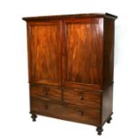 A 19th century mahogany linen press, the pair of panelled doors enclosing linen slides, the base