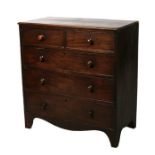 An early 19th century mahogany chest of two short and three graduated long drawers, on bracket feet,