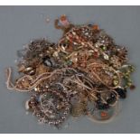 A quantity of costume jewellery to include bangles, necklaces, bracelets and other items.