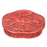 A Chinese cinnabar lacquer box lid decorated birds perched in a tree. 14.5cm wide