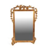 A carved giltwood wall mirror, overall 67 by 97cms.