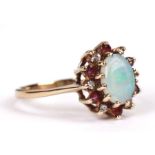 A 9ct gold opal, ruby and diamond cluster ring, approx UK size 'N', 2.5g.