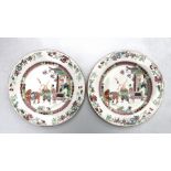 A pair of Chinese famille rose plates decorated with figures and a warrior and his horse, 24cms