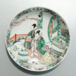 A Chinese famille verte shallow dish decorated with figures on a terrace, six character blue mark to