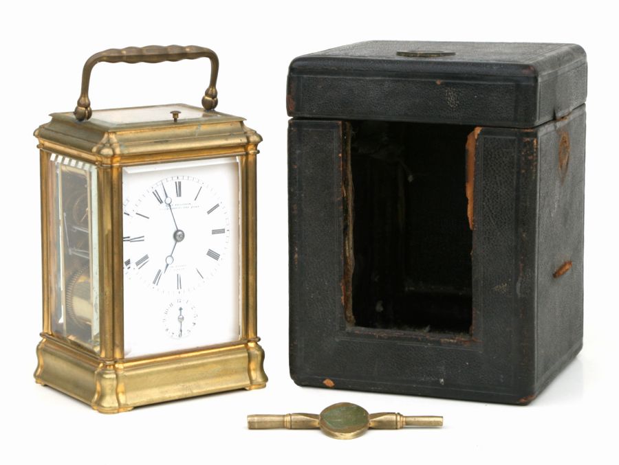 A Charles Frodsham brass cased repeat alarm carriage clock, the white enamel dial with Roman