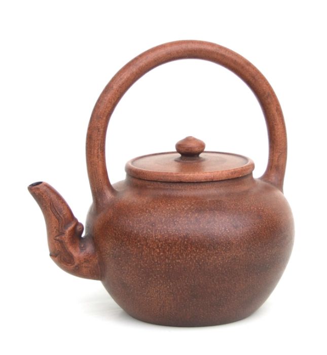 A Chinese Yixing pottery teapot with incised character mark to the underside, 17cms high.Condition