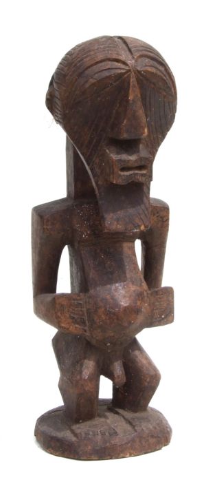 African Art / Tribal Art: a carved wooden Songye male figure, 38cms high.