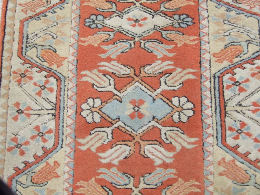 A Persian hand knotted woollen runner with stylised tulip design within geometric borders, on a - Image 3 of 3