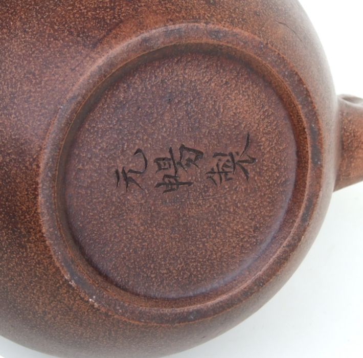 A Chinese Yixing pottery teapot with incised character mark to the underside, 17cms high.Condition - Image 3 of 3