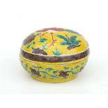 A Chinese Sancai glazed lidded bowl of compressed globular form decorated a bird on a yellow ground,