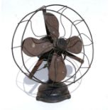 A vintage Art Deco period electric desk fan with cast iron base, 30cms diameter.