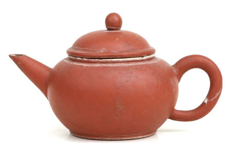 A Chinese Yixing teapot, impressed character mark to base, 8cms high.Condition ReportA chip to to