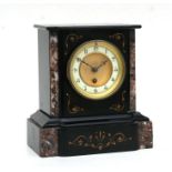 A Victorian black slate and marble mantle clock, the cream enamel chapter ring with Arabic numerals,