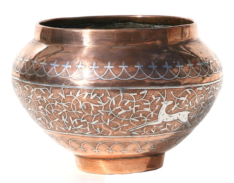 An Indo Persian copper bowl with white metal inlay, 18cm diameter