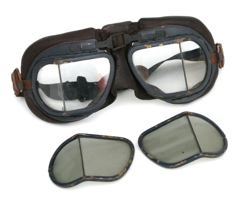 A pair of WWII Air Ministry marked flying goggles with spare tinted lenses.