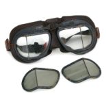 A pair of WWII Air Ministry marked flying goggles with spare tinted lenses.
