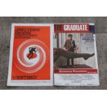 Two cinema lobby cards for 'Vertigo' starring James Stewart and Kim Novak: and 'The Graduate',