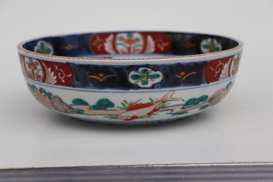 A Japanese Imari bowl decorated with birds in a river landscape, 25cms diameter together with a pair - Bild 14 aus 16