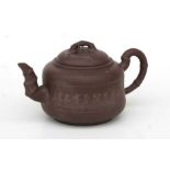 A Chinese Yixing pottery teapot with incised calligraphy, impressed character mark to the