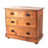 A late 19th century pine chest of three graduated long drawers, on a plinth base, 92cms wide.