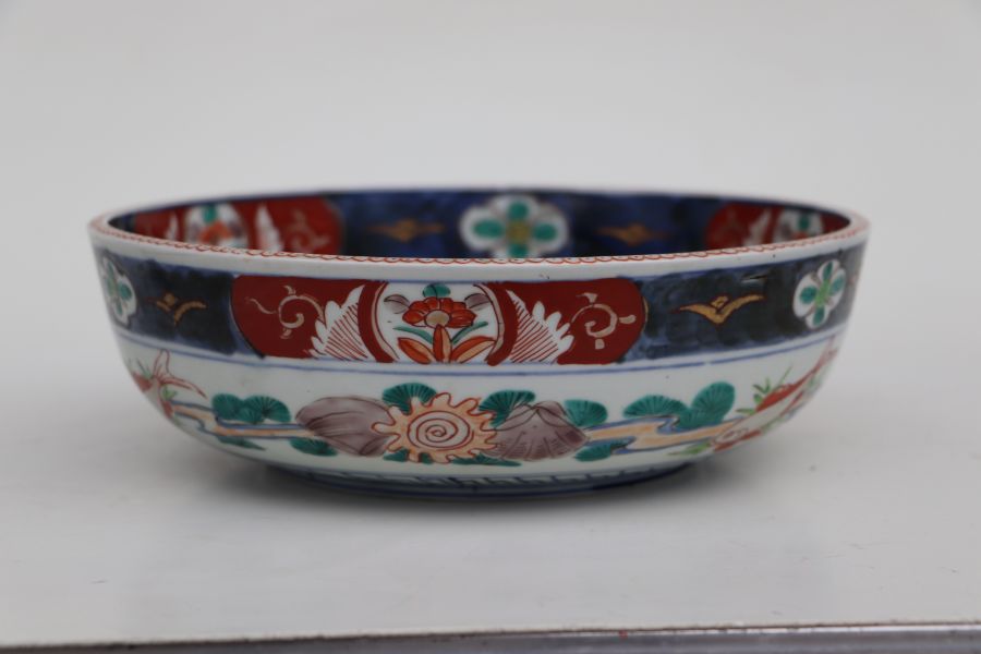A Japanese Imari bowl decorated with birds in a river landscape, 25cms diameter together with a pair - Bild 11 aus 16