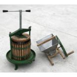 A Vigo Ltd green painted apple press and masher.Condition ReportWooden parts 32cms high by 28cms
