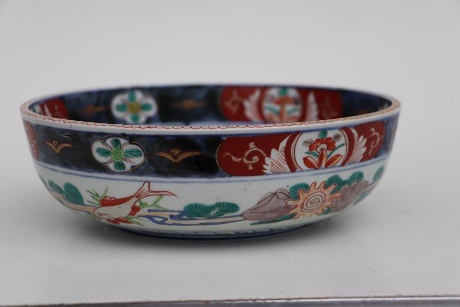 A Japanese Imari bowl decorated with birds in a river landscape, 25cms diameter together with a pair - Bild 12 aus 16