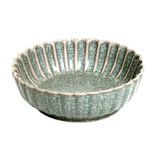 A Chinese crackle ware celadon glaze shallow dish or brush washer, 13cms diameter.