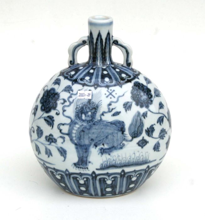 A Chinese blue and white two handled vase, decorated flowering foliage and temple lions, 28cm high