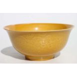 A Chinese Imperial yellow glazed footed bowl, with sgrafitto decoration and depicting dragons