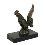 A cast bronzed sculpture in the form of a cockerel, on a plinth, 13.5cms high.