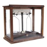 A cased set of Griffin & Tatlock laboratory scales, marked 'Duorider', 46cms wide.