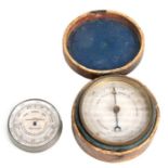 A 19th century Holosteric barometer, 6.5cms diameter, cased; together with a Cox Devonport &