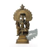 An Indian bronze figure depicting a deity, 22cms high.