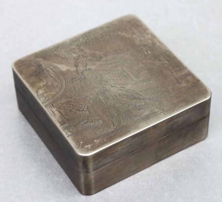 A Chinese silvered copper ink box, decorated ladies in a terraced garden with seal mark to the