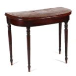 A 19th century mahogany demi-lune tea table with ebony stringing, on ring turned tapering legs