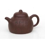 A Chinese Yixing pottery teapot decorated with bamboo and calligraphy, impressed four character seal