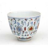 A Chinese douaci tea bowl, decorated flowers with a six character mark to the underside, 8cm