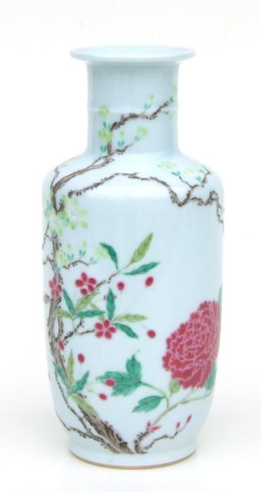 A Chinese rouleau vase decorated with flowering foliage, 22cms high.